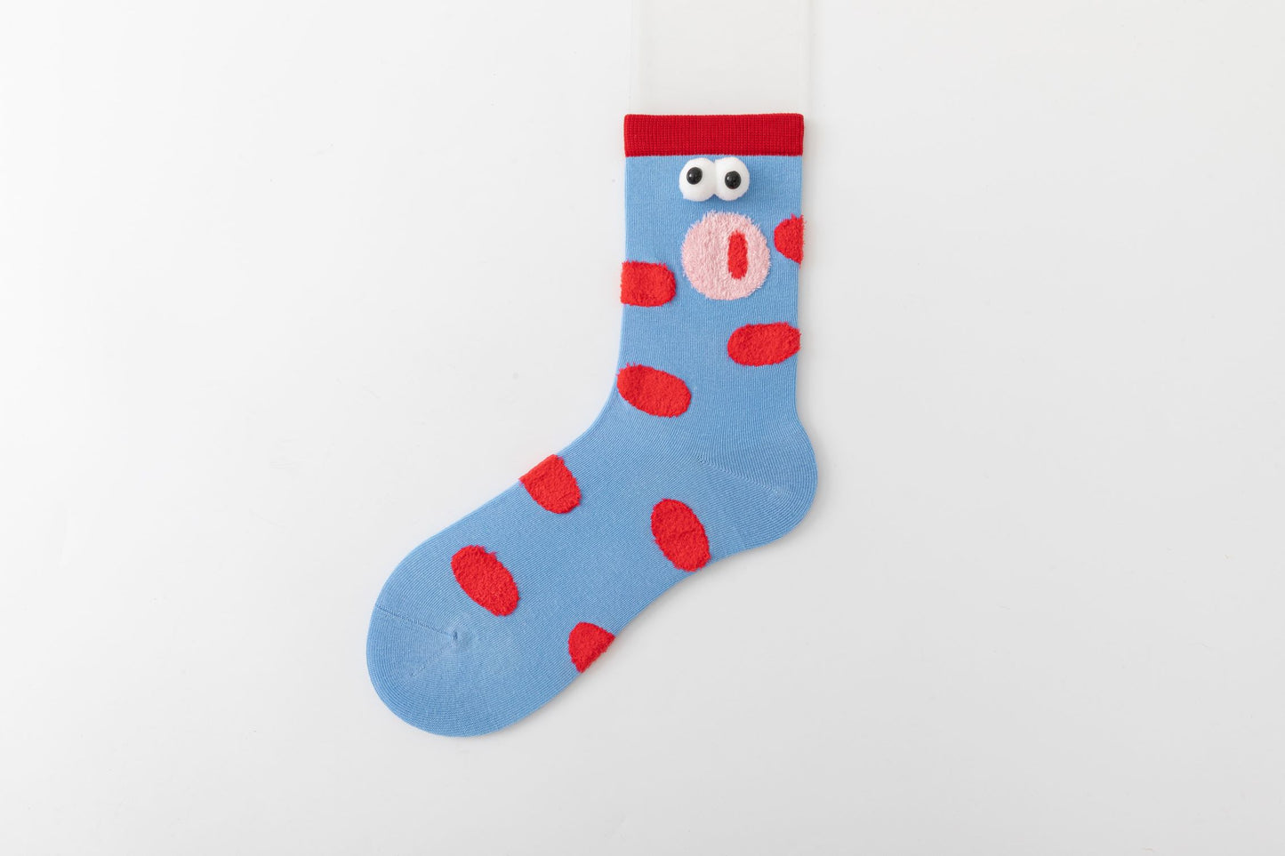 Blue soft cotton crew socks, with playful cartoon faces and red dots