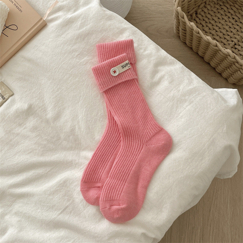 ChicToes pink crew socks, with a white button at the ankle area