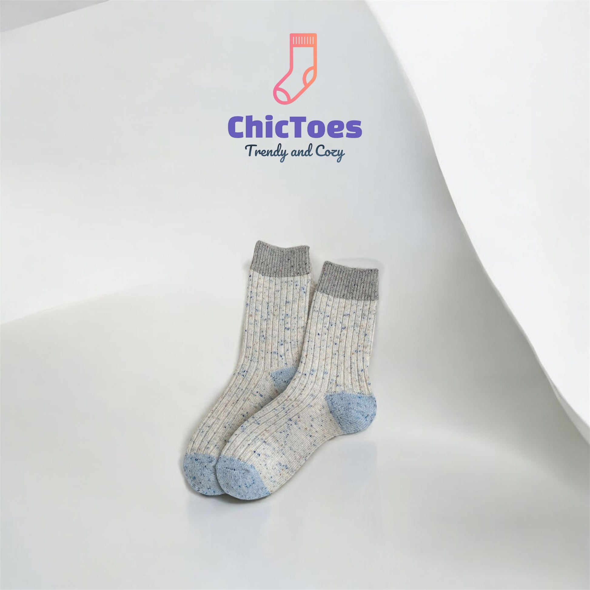 A ribbed sock in soft grey with hints of blue, paired with a muted grey heel and toe, resembling the delicate tones of a refreshing sea salt milk tea