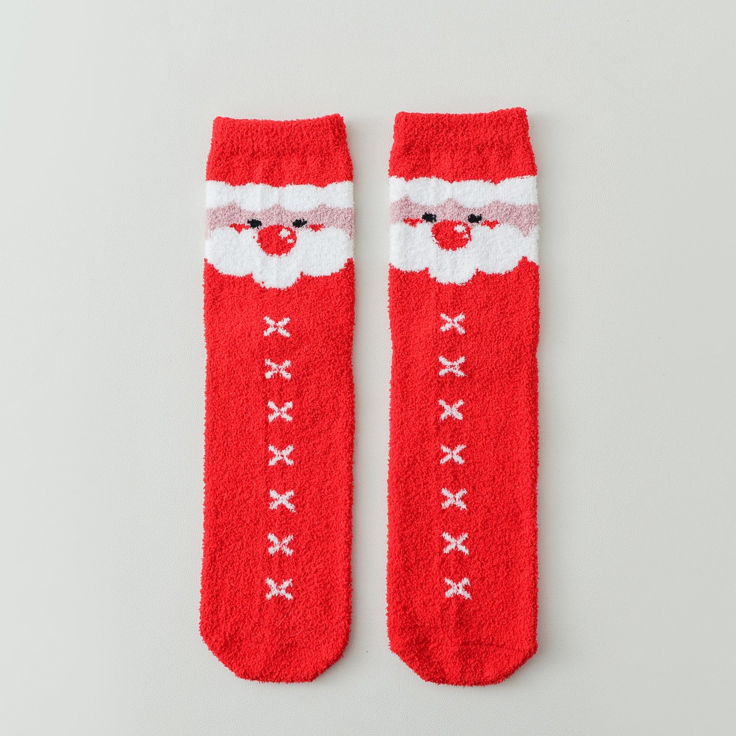 ChicToes fuzzy and cozy sleep socks in red and santa's face pattern